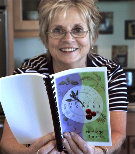 Penny  of Heritage Shores holds a cookbook