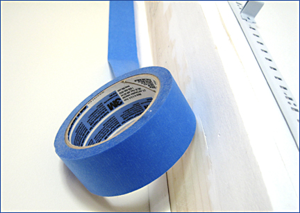 Painters tape to help paint bookshelf in a Heritage Shores home in Bridgeville DE. Photo by E.W. Faircloth