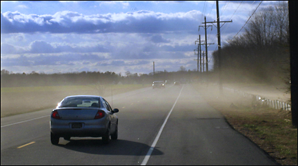 Dust blows past a field on Rt. 9 near Rehoboth Beach DE. Photo by E.W. Faircloth