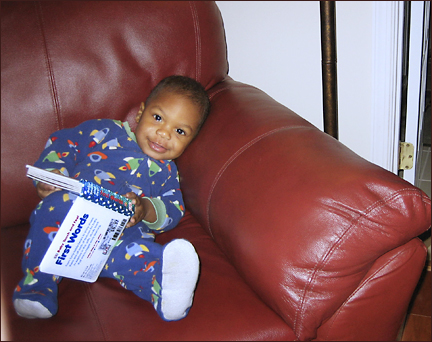 Naji reads a book.  Photo by E.W. Faircloth