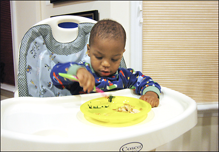 Naji eats by himself.  Photo by E.W. Faircloth