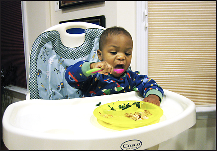 Naji eats by himself.  Photo by E.W. Faircloth